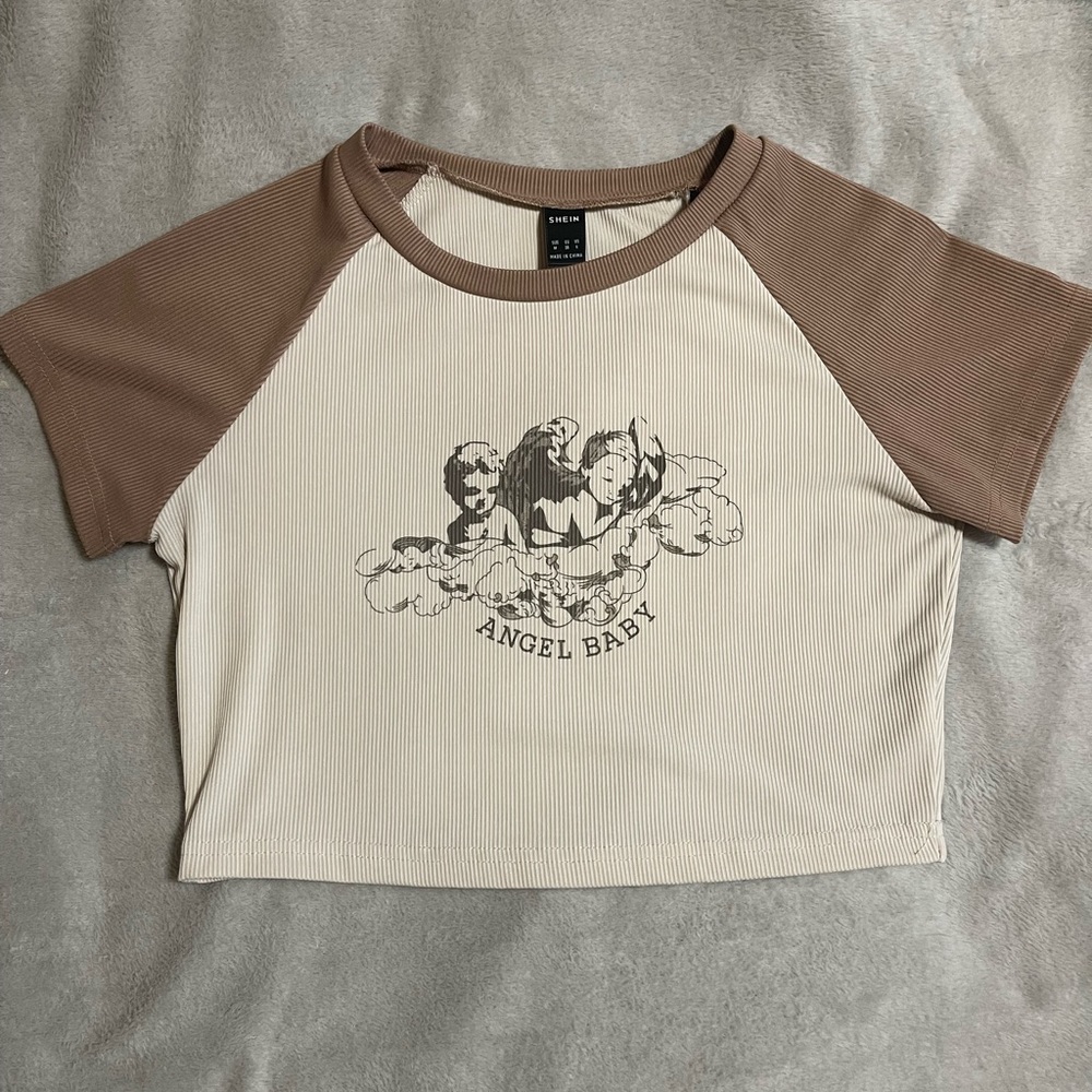 From skein, brown and cream cropped shirt with graphic design.